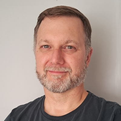 Oz Harbottle smiling for a headshot image
